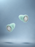 Lyve Sleep™ Ultra-Comfort Earplugs in seafoam falling through the air 