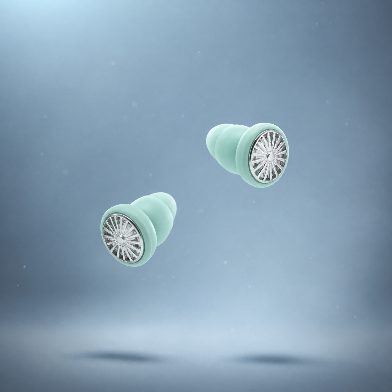 Lyve Sleep™ Ultra-Comfort Earplugs in seafoam falling through the air 
