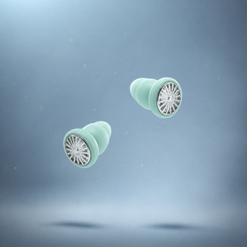 Lyve Sleep™ Ultra-Comfort Earplugs in seafoam falling through the air 
